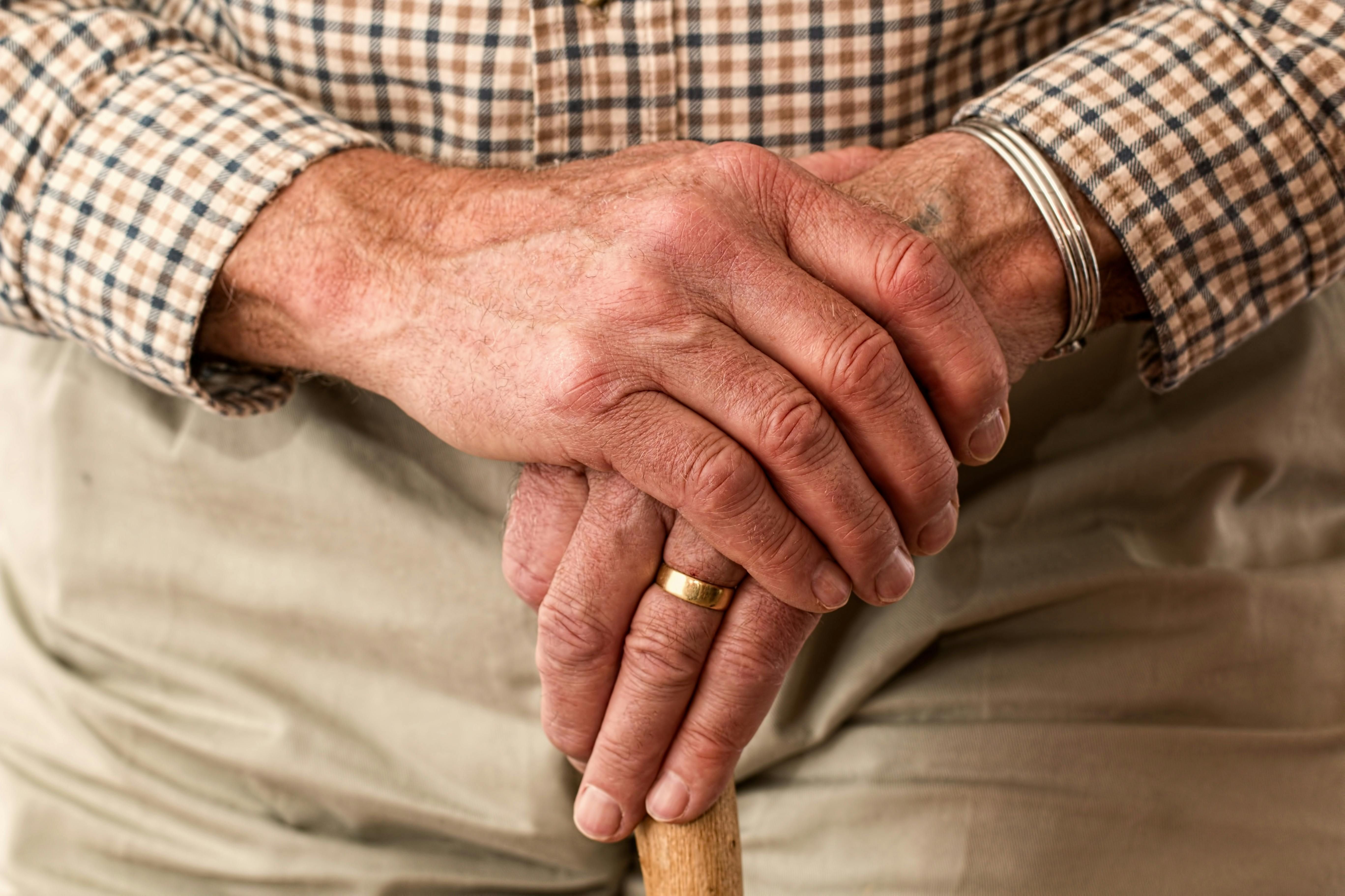 old person holding a cane